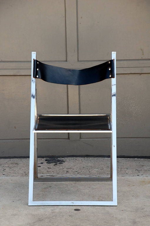 Late 20th Century Minimalistic chrome and leather folding chair edited by Lübke