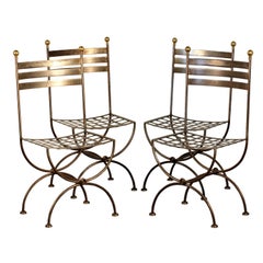 Set of 4 French polished steel and brass chairs