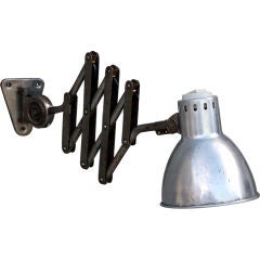 Polished steel French industrial extentable sconce
