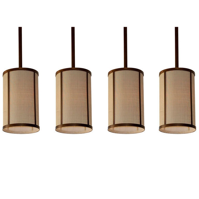 Set of Four 'Cylindre' Patinated Brass & Raffia Pendant Lights by Design Frères For Sale
