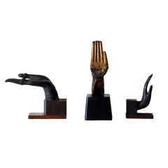 Collection of antique bronze Buddha hands on stands