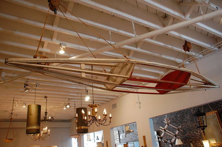 Early 20th century canoe with set of hoisting pulleys