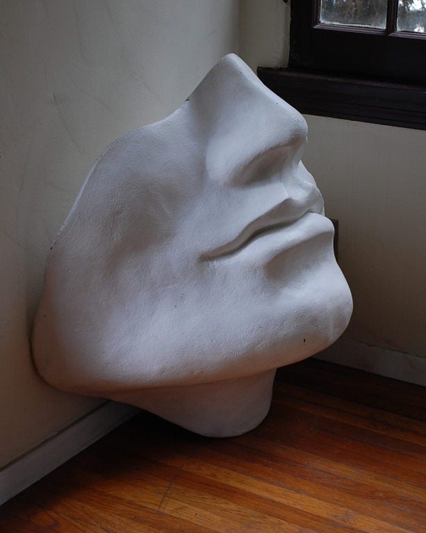 Unusual large faux plaster face sculpture.