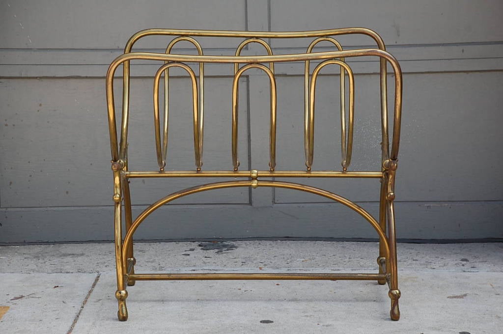 Unique solid brass fireplace wood rack by Siegel Paris. Signed on plaque.