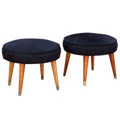 Pair of mid-century low stools with brass sabots