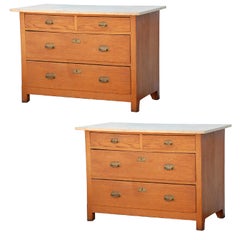 Pair of Arts & Crafts oak and travertine chest of drawers