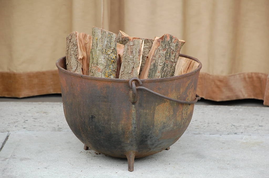 American Patinated iron cauldron / firewood holder
