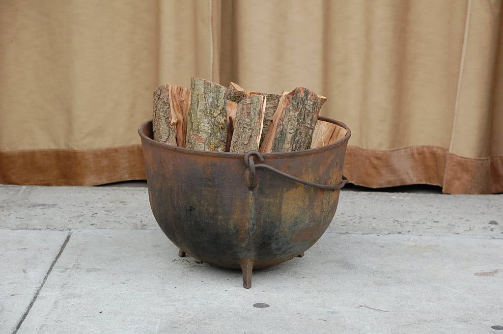 20th Century Patinated iron cauldron / firewood holder