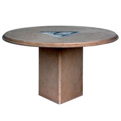 Round low travertine table with geometric inlay