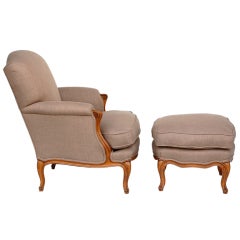 Comfortable Louis XV style armchair and matching ottoman