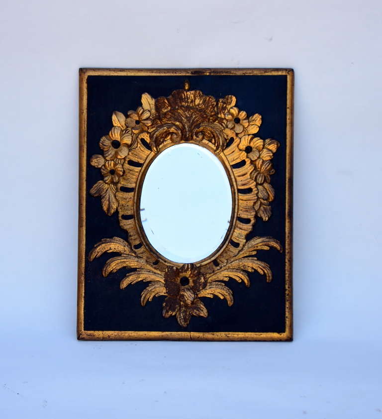 Elegant Small Black and Gilt Carved Wood Mirror
