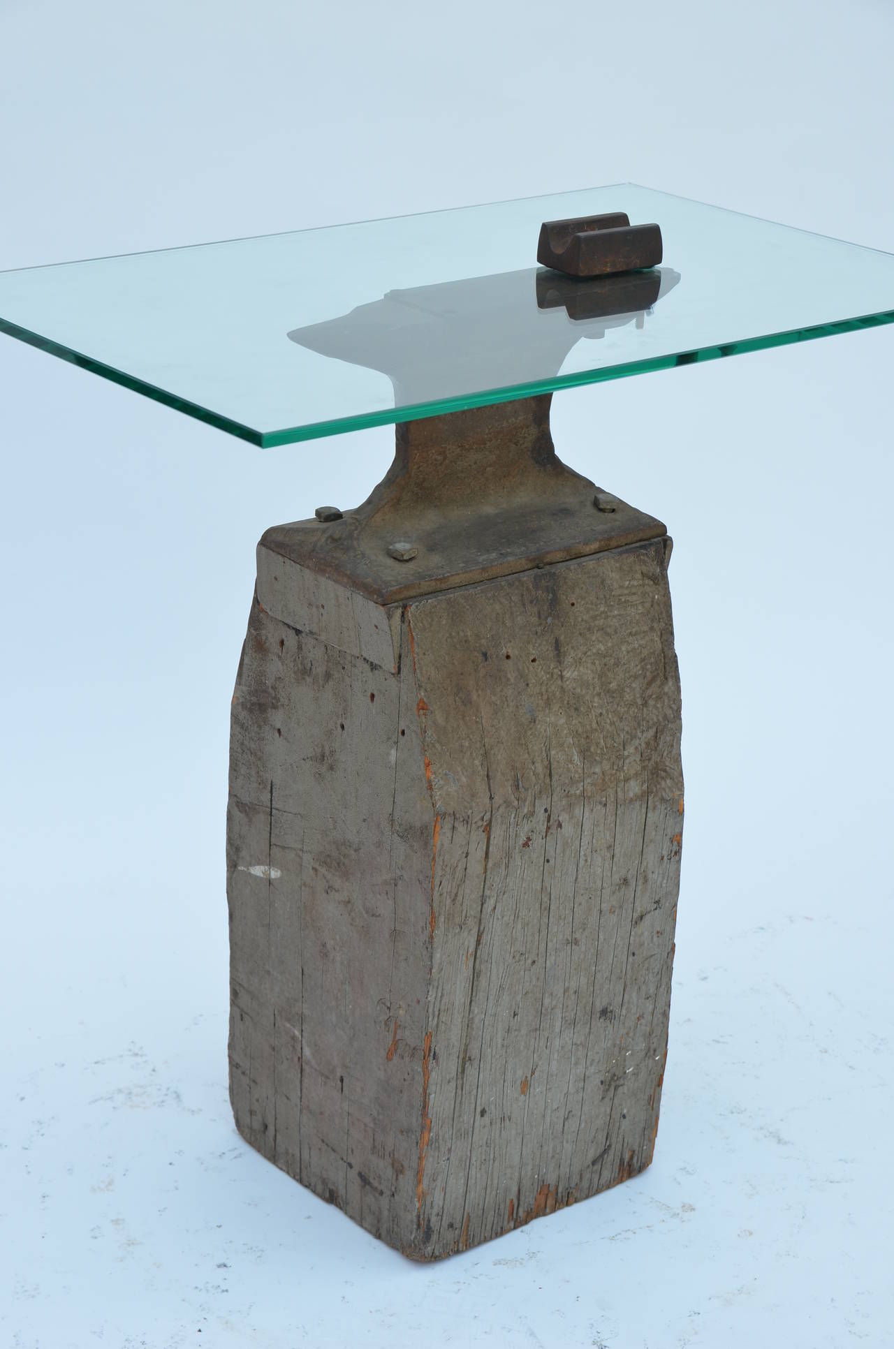 Industrial Anvil Transformed into a Unique Side Table. Anvil base is vintage and glass top is new. Very heavy and sturdy.
