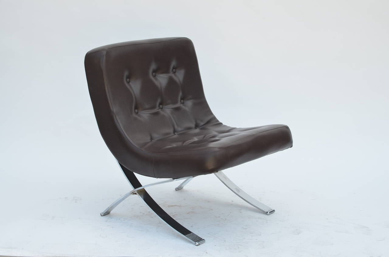 Pair of chromed Italian 70s slipper chairs. Original dark brown vinyl seats in excellent condition. Great vintage design for a change from the Barcelona chair...