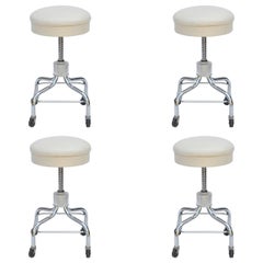 Set of Four Vintage Chrome and White Leather Adjustable Rolling Stools