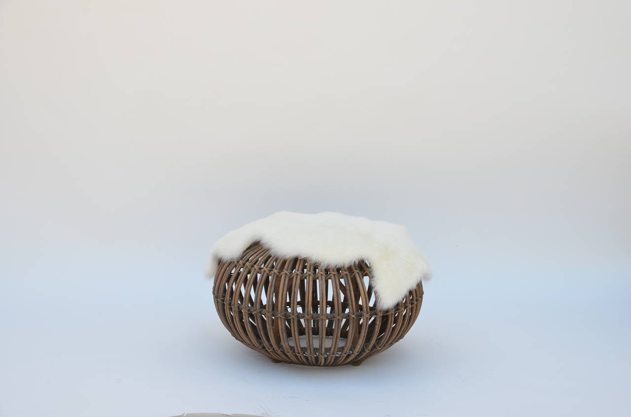 Rattan Ottoman or Stool in the Style of Franco Albini with Fur Cover. Very sturdy but lightweight.