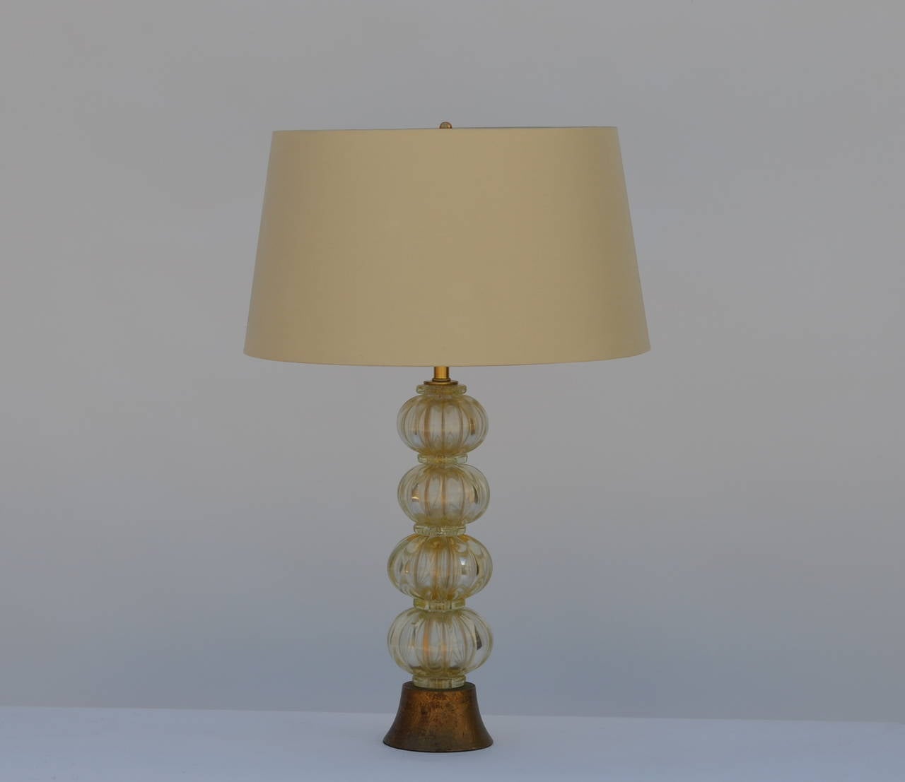 Heavy Gilt Murano Glass Stem Lamp with Custom Silk Shade in the style of Barovier. Gilt wood base. Restored and rewired with gold twist cord.

Custom shade dimensions: upper edge 16 inches, lower edge 19 inches, height 10.5 inches. Overall lamp