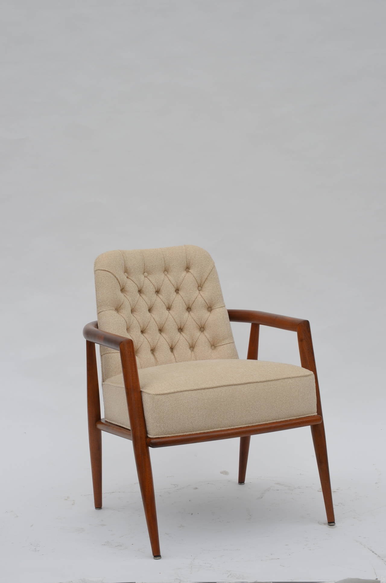 Elegant Tufted Back Armchair by Leslie Diamond for Conant Ball. Cream linen upholstery. 25 in. arm height.