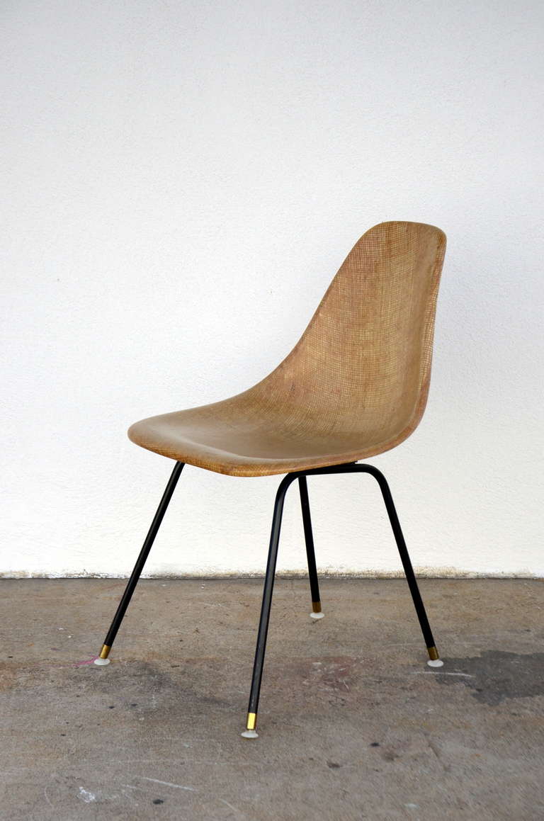 Fiberglass-encasted fabric mesh shell chair.

Great as a desk or a side chair.