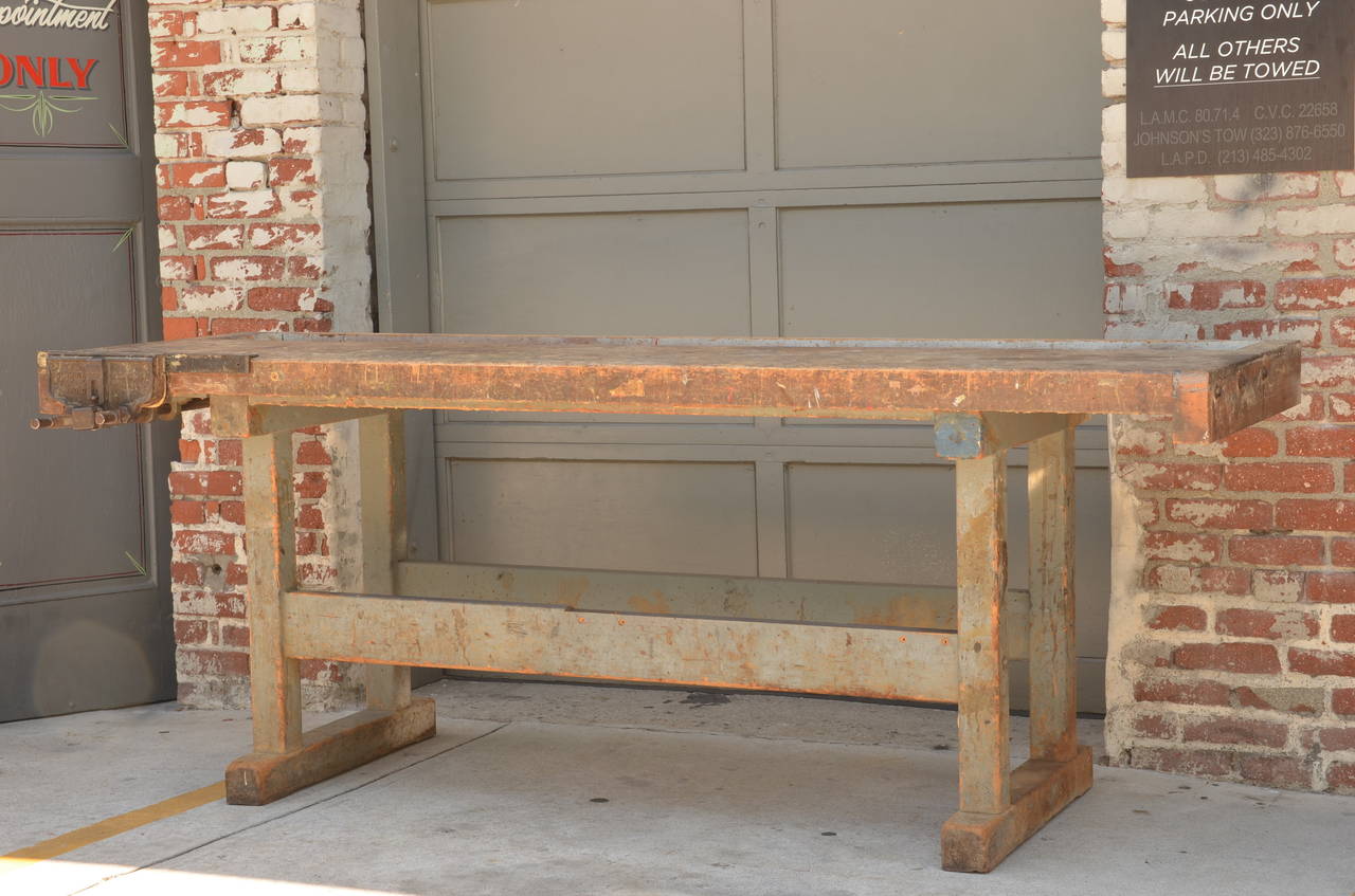 Impressive Industrial Workbench with Cast Iron Vise In Distressed Condition In Los Angeles, CA