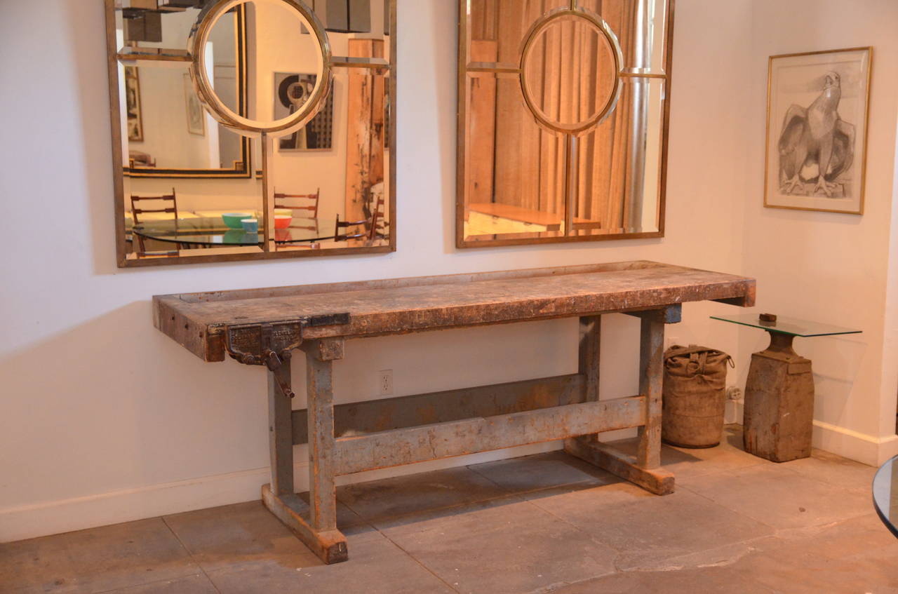 Impressive Industrial workbench with cast iron vise. Fully functional. Great as a large console or as kitchen center island.