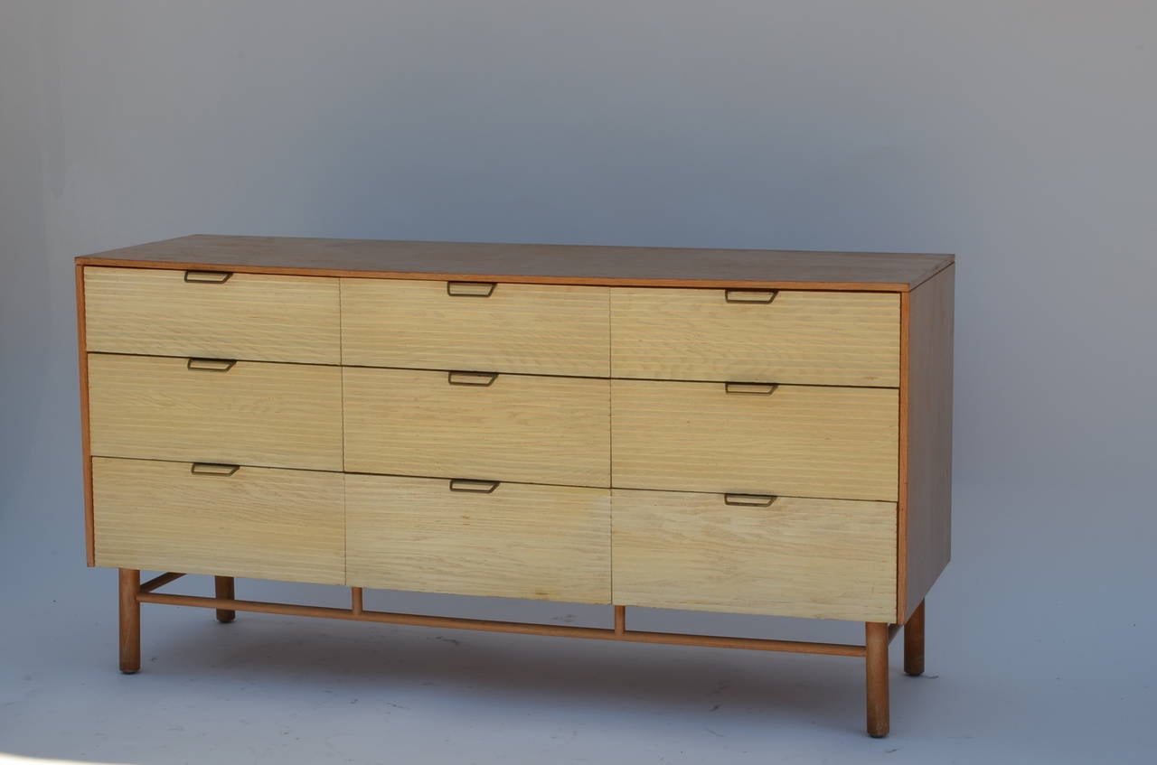 Impeccable nine-drawer dresser by Raymond Loewy for Mengel. Integrated vanity. Very good original vintage condition. Stamped inside the top left drawer.