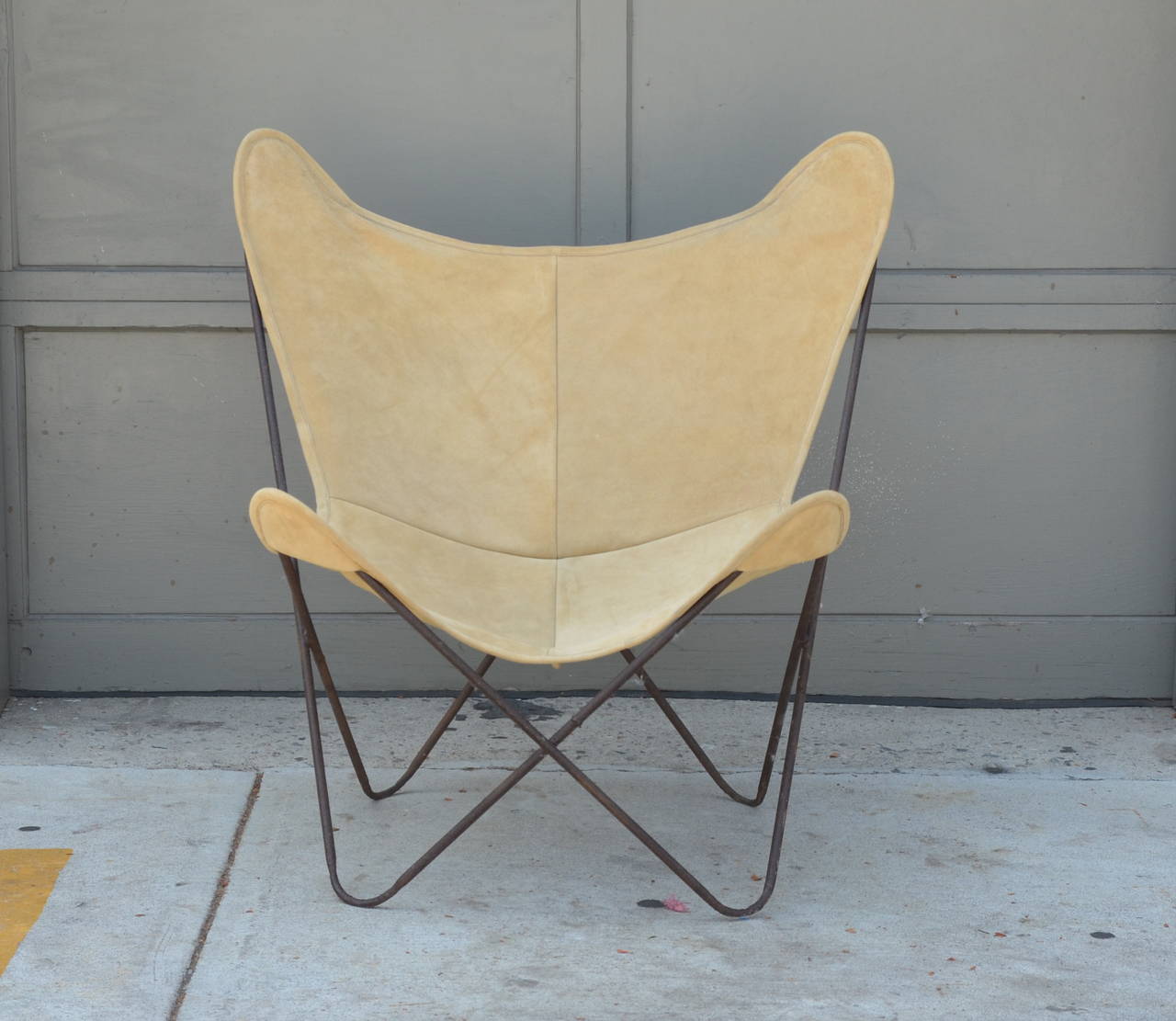 Pair of original vintage Hardoy butterfly chairs in suede.