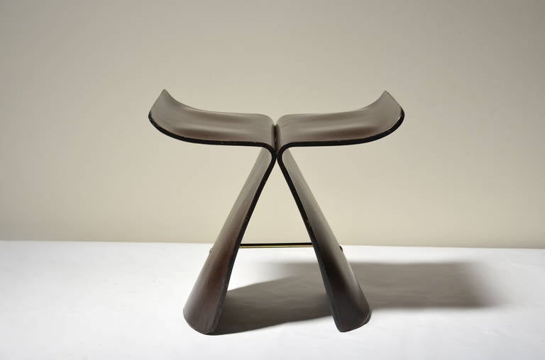 Iconic Rosewood Butterfly Stool by Sori Yanagi. Beautiful grained rosewood veneer with a brass stretcher. 15 in. seat height.