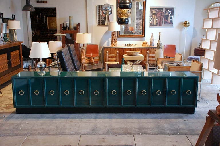 Spectacular Hollywood Regency custom emerald green lacquer sideboard. In the style of Tommi Parzinger or James Mont