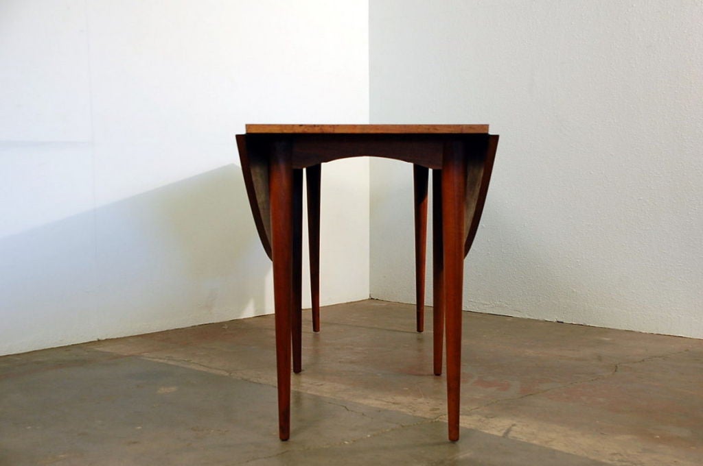 Wood Oval drop-leaf dining table by Edward Wormley for Dunbar