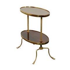 Two tier oval mahogany and brass side table
