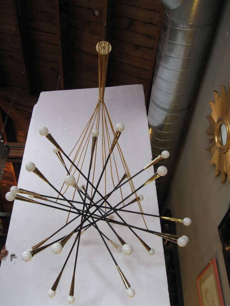 This innovative sputnik chandelier prides itself in its Italian origin. Already rewired and refinished.