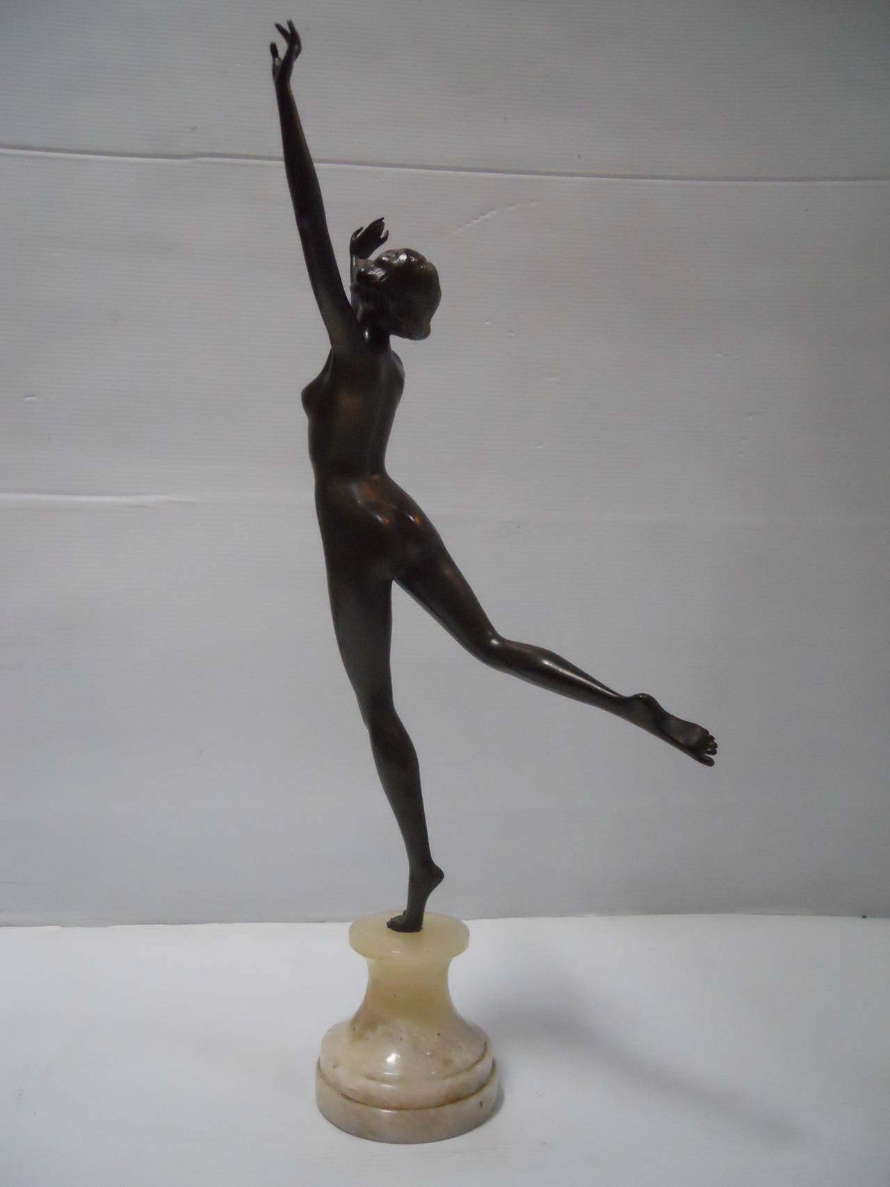 Fabulous Josef Lorenzl female statue.

This engaging bronze statue from the 1920s by Josef Lorenzl (1892-1950) depicts a fabulous dancing woman posed. The figure is artfully captured with one leg in the air and mounted on a cylindrical onyx