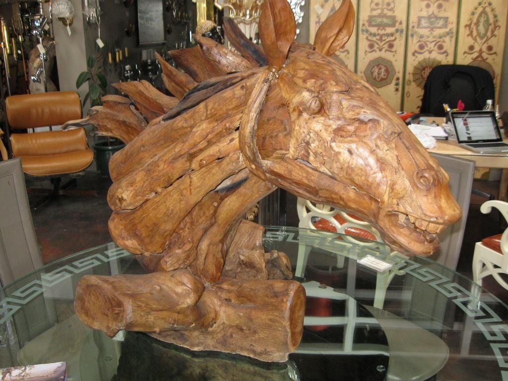 A unique rustic horse sculpture. Made of part old found wood and part driftwood. Very rustic and would look great in a vacation lodge or country retreat.