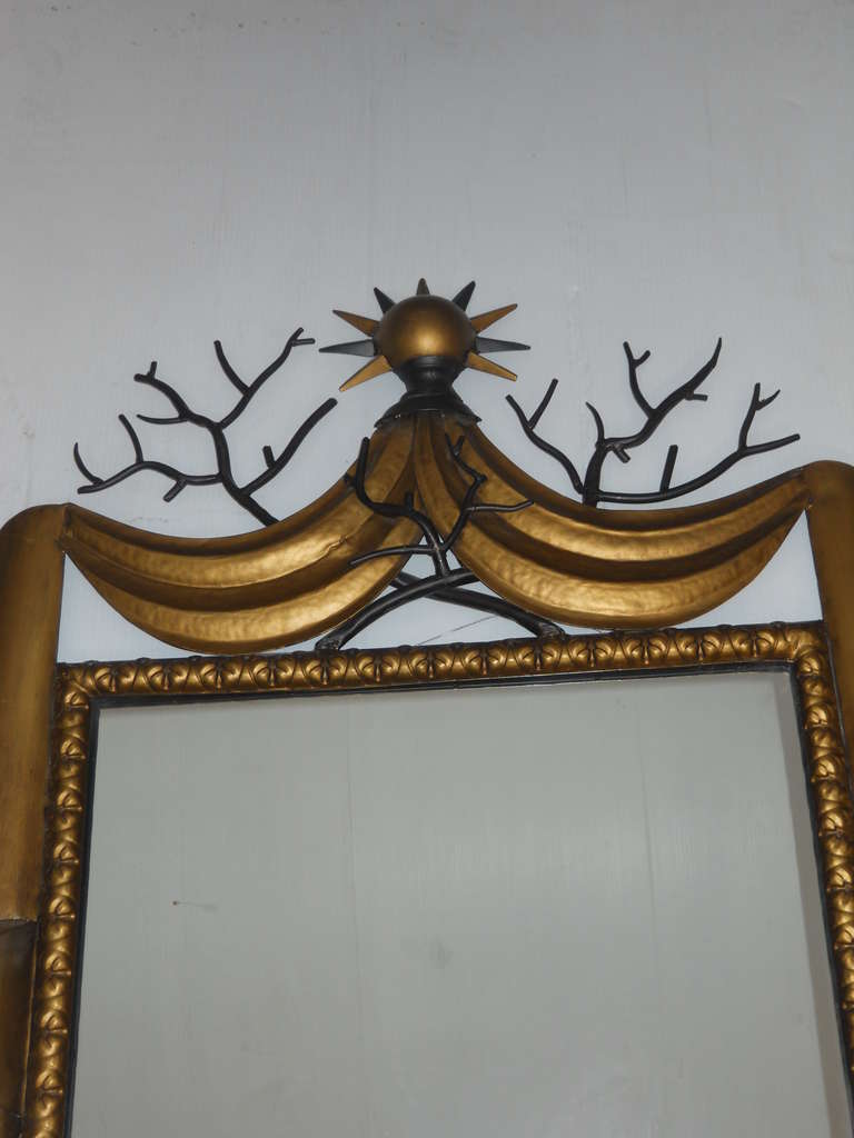 Gold painted whimsical iron mirror in the manner of Gilbert Poillerat.