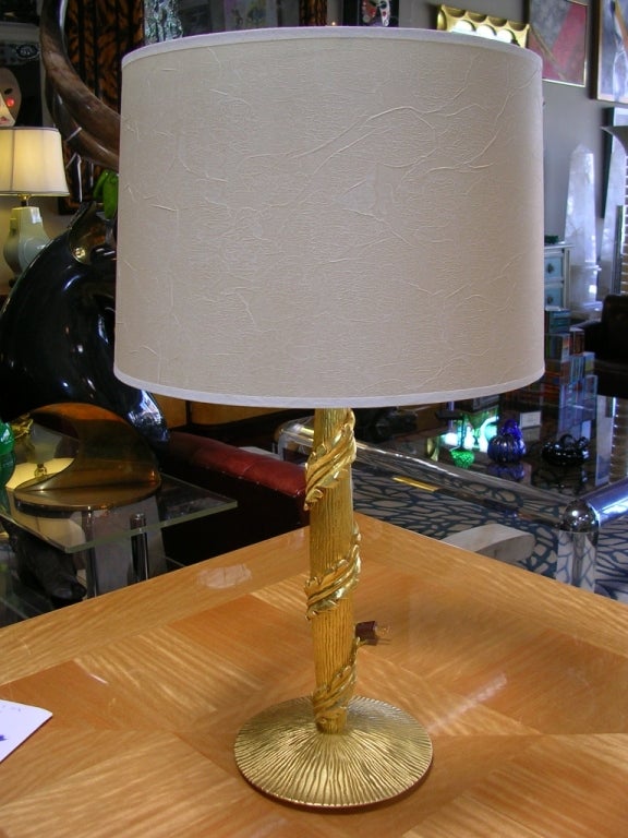 An elegant pair of 22k gold leaf table lamps by Bryan Cox. In his lighting line, this lamp was the Ankor model. Height of the lamp is 30