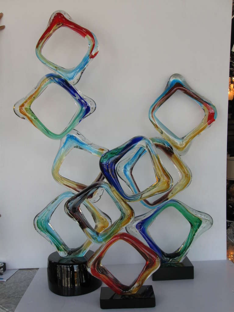 Beautiful set of 3 Italian geometrical Sculptures. Hand blown in Murano, Italy by Maestro Camozzo. 

Dimensions: S: H 26.5' x 8.5