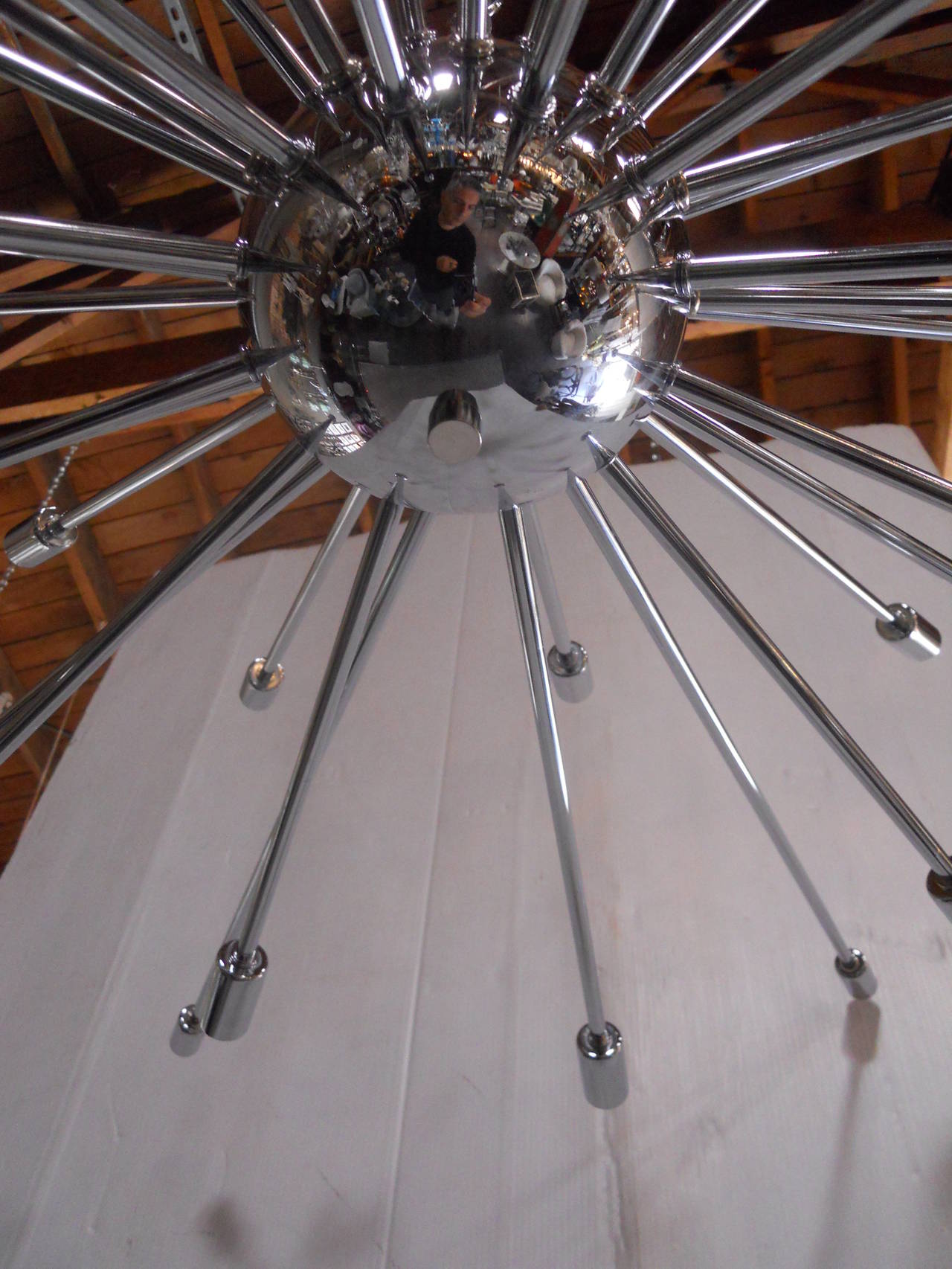 Sleek Sputnik Chandelier
in working condition
the measurements below include just the body of the chandelier with the exisisting pole
The canopy and chain can be provided upon request
36 candelabra socket type light bulbs
