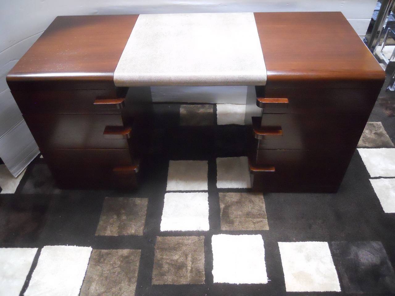Sophisticated Gilbert Rohde for Herman Miller desk.
Newly refinished.
Faux shagreen.
American walnut outside body and mahogany inside all six drawers.