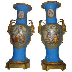 Ornate Pair of Cobalt Porcelain and Gilt Bronze Sevres Urns