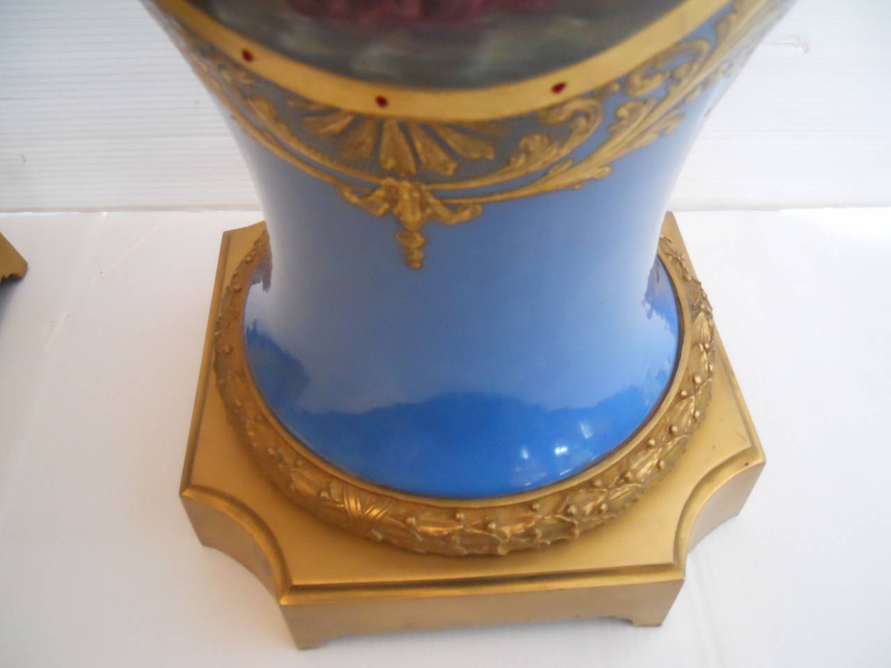 Late 19th Century Ornate Pair of Cobalt Porcelain and Gilt Bronze Sevres Urns