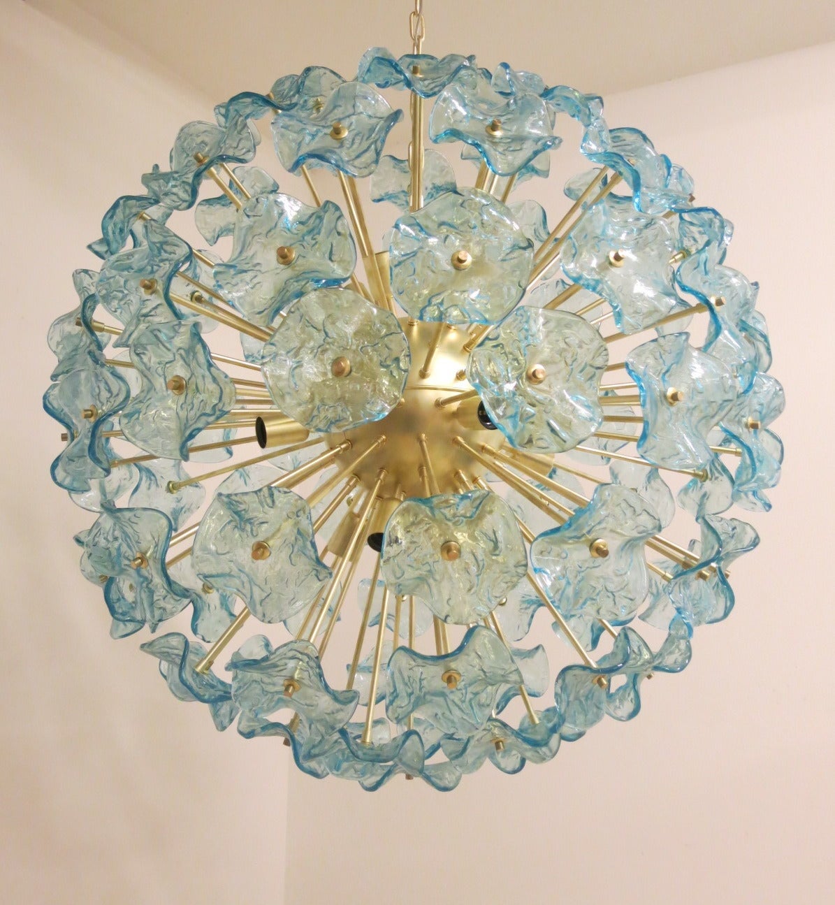 Beautiful Italian Murano glass aquamarine flowers chandelier. 
Handblown Murano glass and brass metal.
Measure: 12 lights x E26 type bulb, max 40 W each.
The measurements below are just for the body of the chandelier. The measurements do not