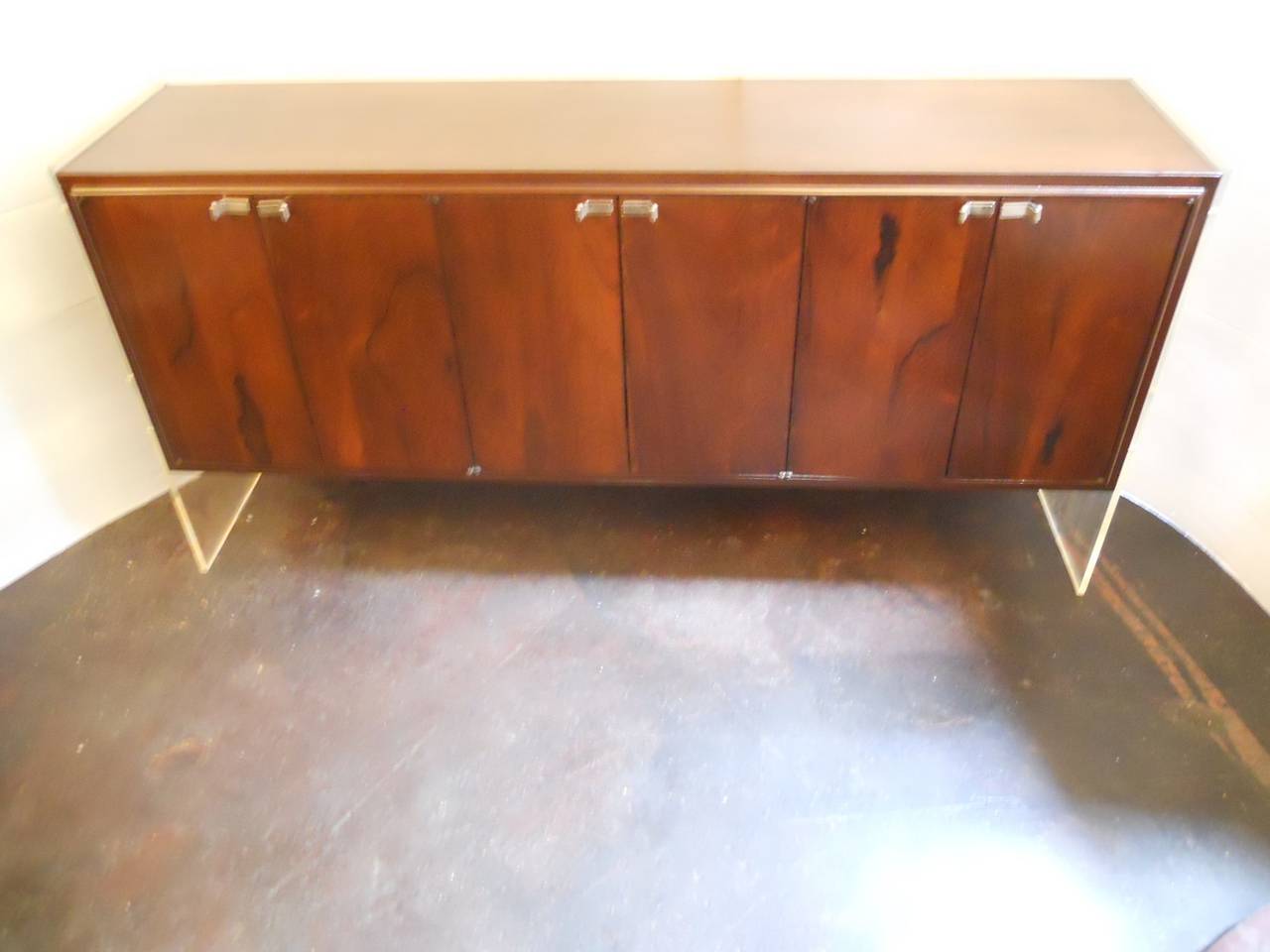 Modern credenza by Flair, Inc.
Material: Rosewood, walnut, acrylic, aluminum.