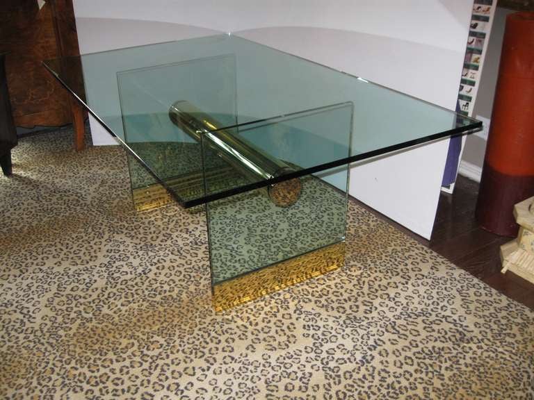 Chrome and brass dining table by Pace International. Would also be great as a desk. Two vertical glass sides with brass bases connected by a thick brass cylinder. Has a 3/4