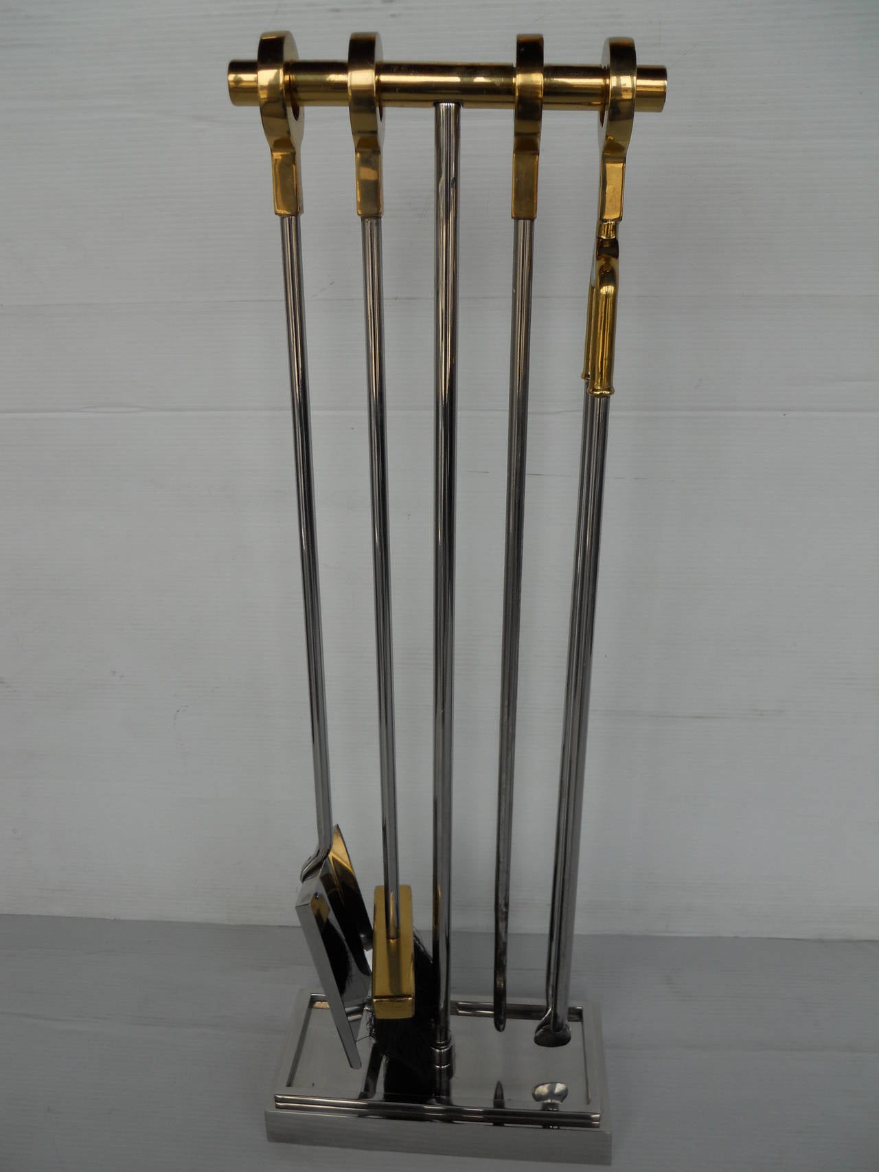 Bronze and polished nickel fireplace four piece tool set.