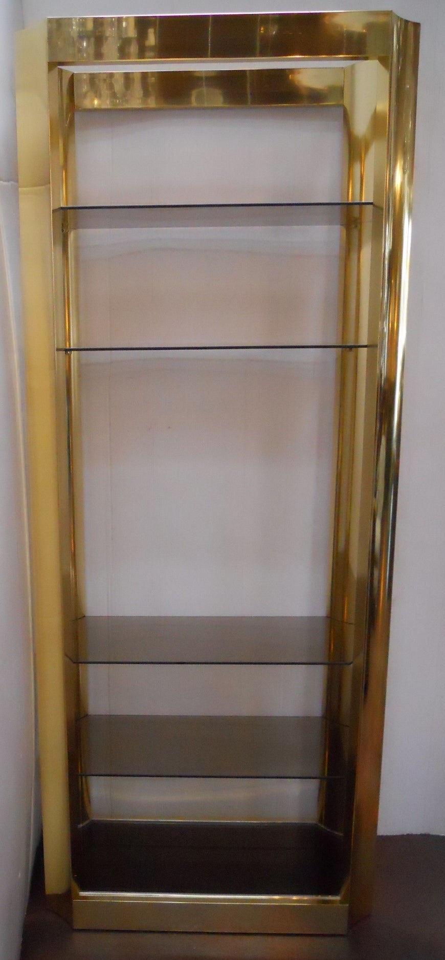 Pair of American vintage etageres.
Aluminum gold-plated.
Five glass pieces per each etagere. All have been recently replaced.