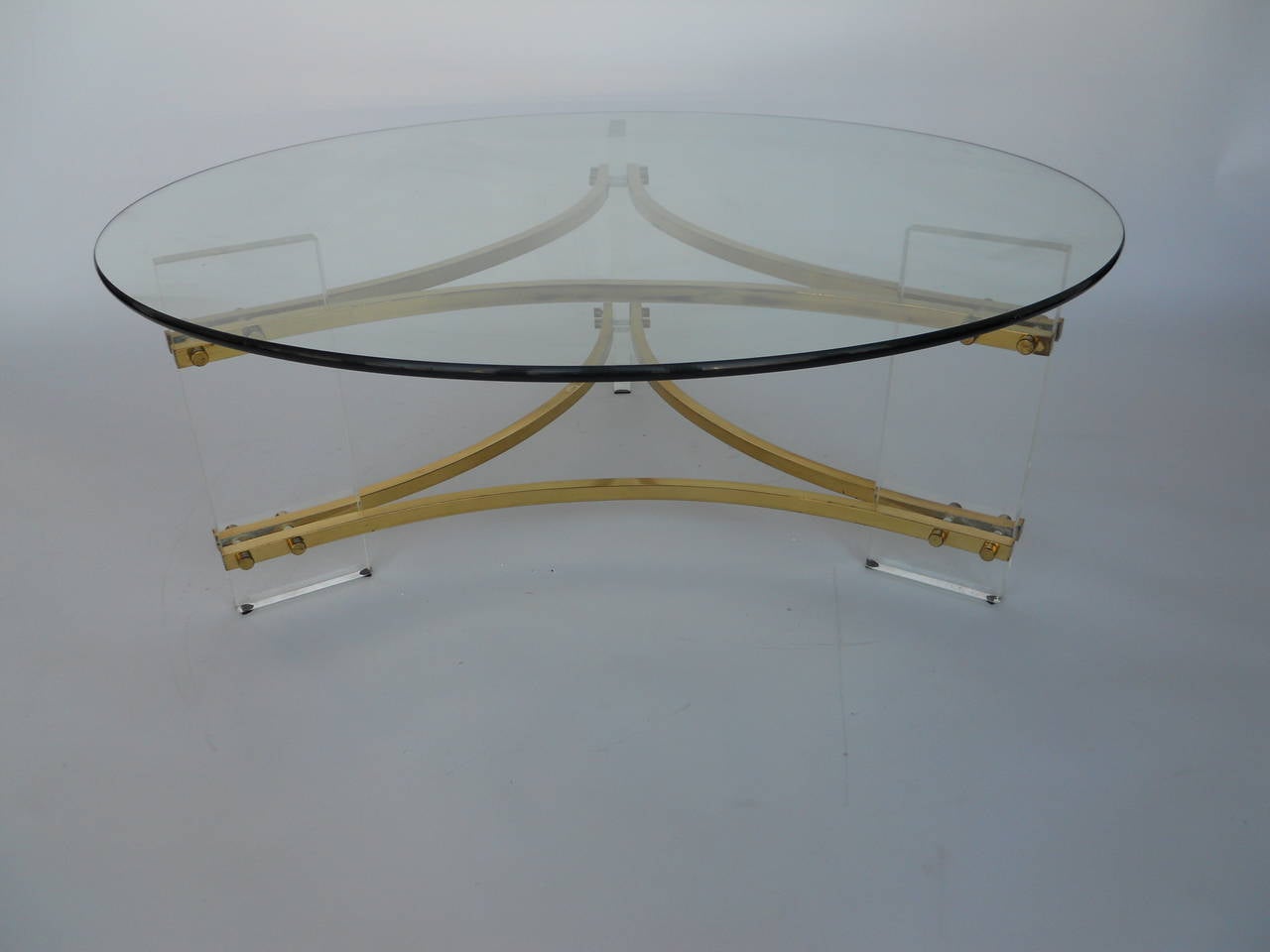 Coffee table by Charles Hollis Jones.
Lucite and brass base with glass top.