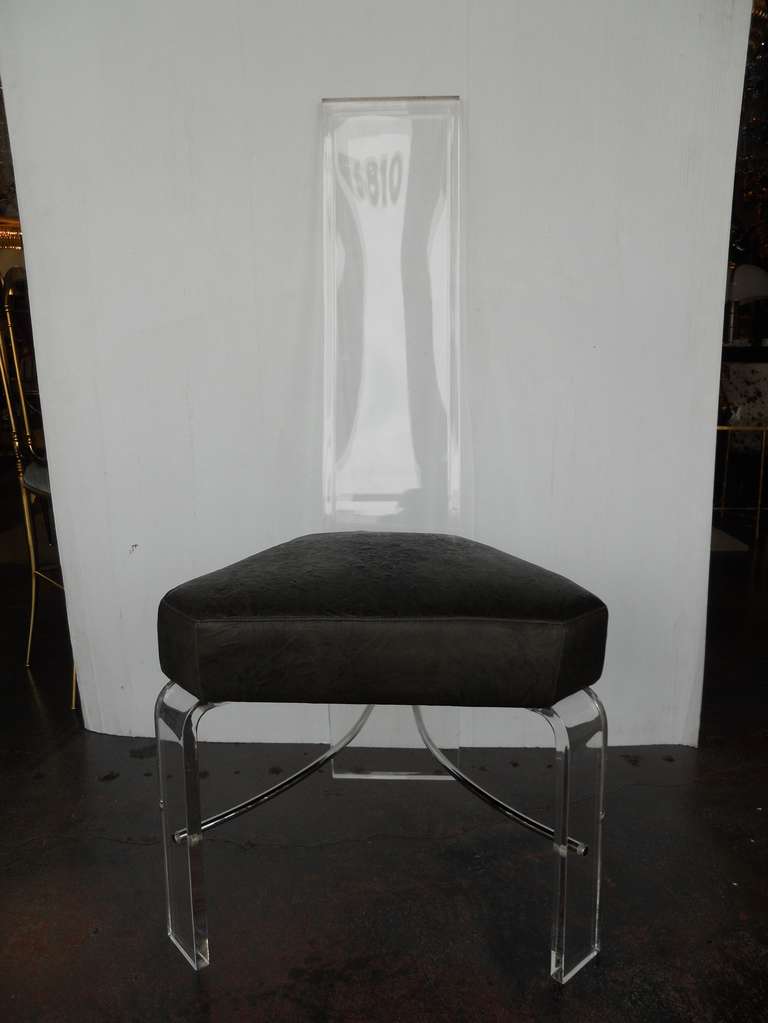 Impressive Alessandro Albrizzi Set of Eight Lucite Chairs
newly upholstered in subtle distressed steel grey leather