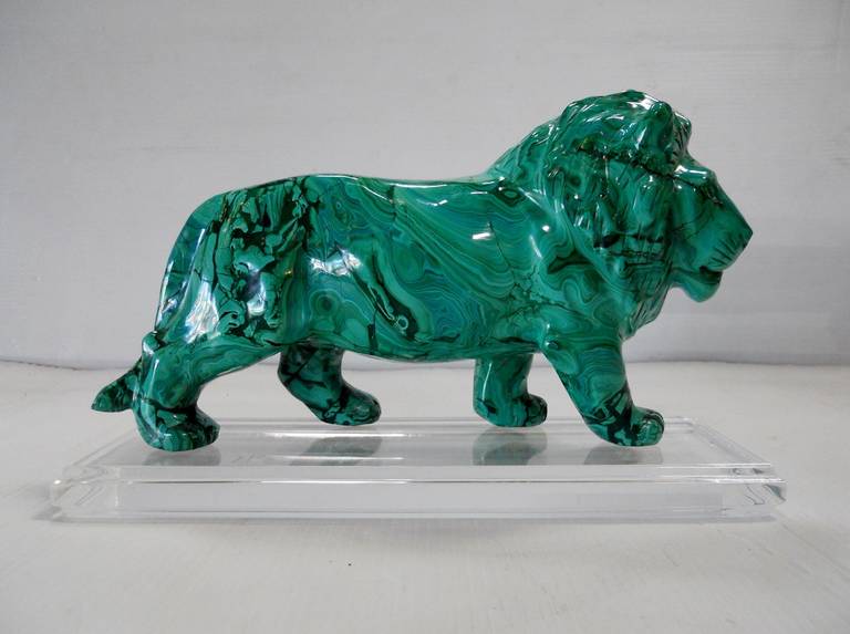A wonderful hand-carved solid malachite lion. Comes with a stepped Lucite stand.

Lion alone stands 12.5