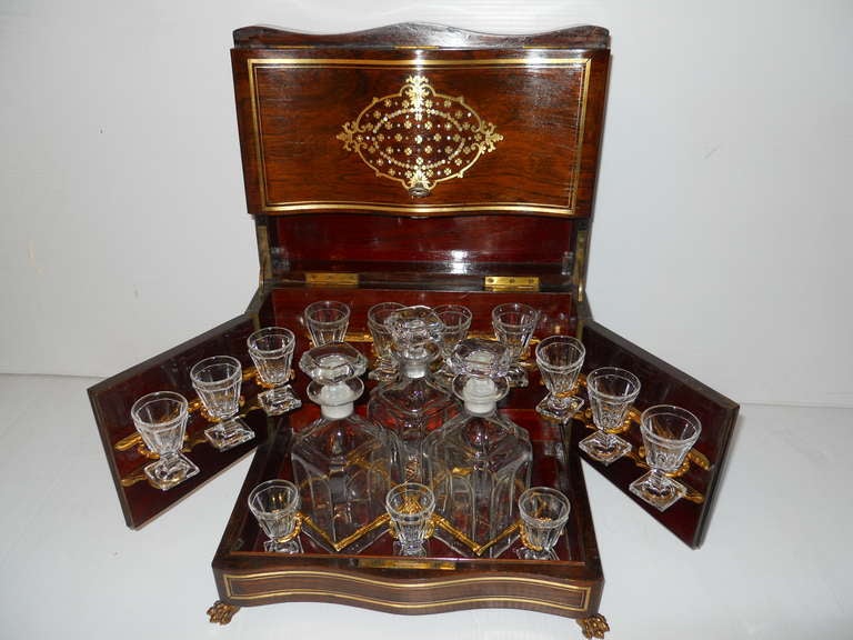 Authentic French Serving Set, consisting of mother of pearl and brass inlay box and Baccarat set. of 12 glasses and 3 decanters.
It has a faux bamboo brass work inside, holding each glass in it's secure position.