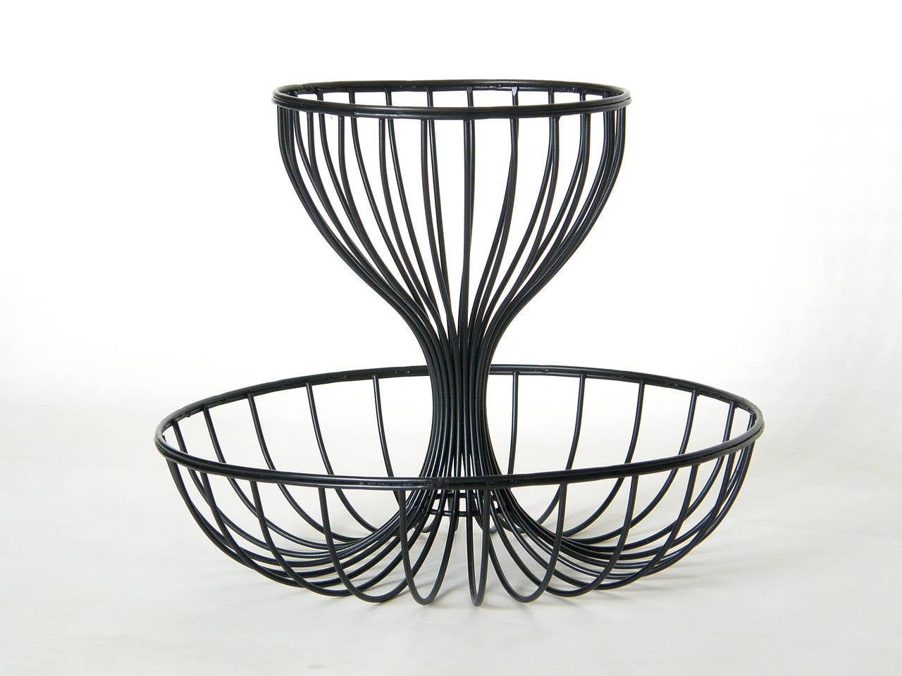 Two-tiered wire basket designed by Andree Ferris and Reta Shacknove. Ferris Shacknove’s line of 